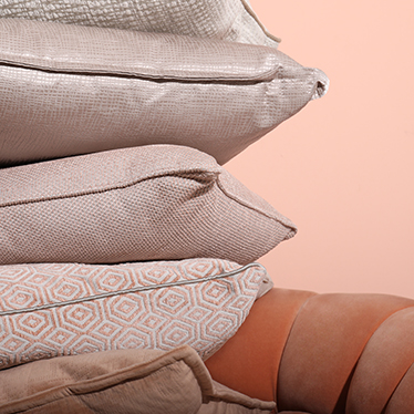 When the Eclectic, Geometric and Modern pillows meet the refined elegance of the ESSEX Rare Armchair in a soft orange color scheme, your home decor will be ready to bring Summer feelings indoors.